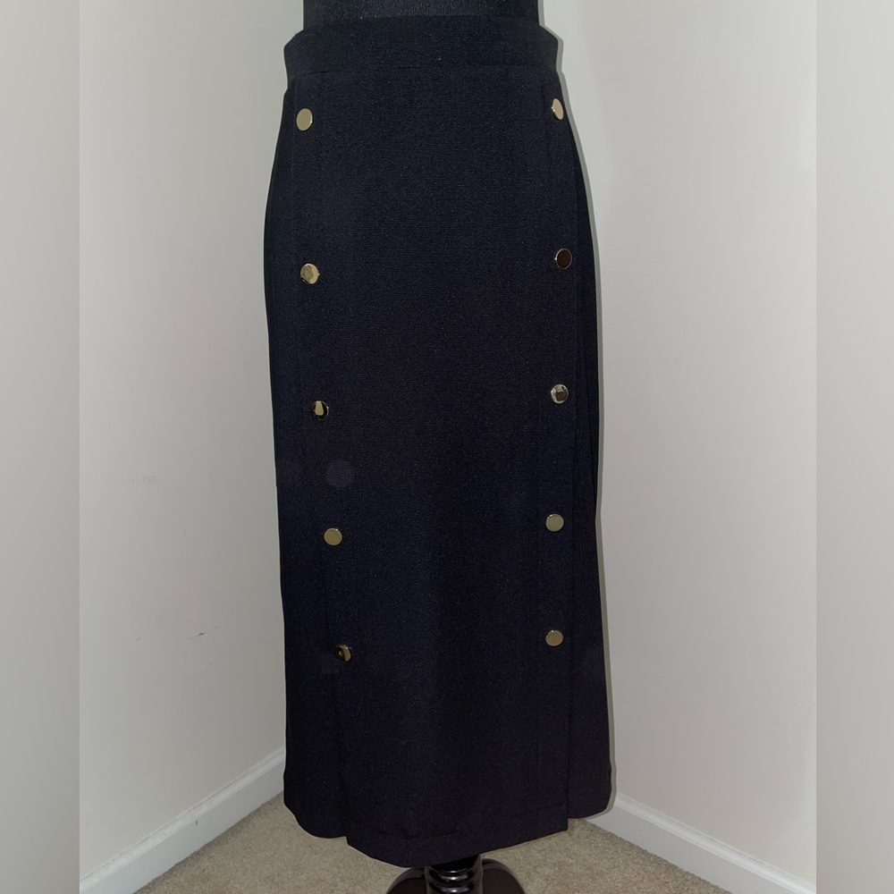 Express mid length black skirt with gold buttons and two front slits, size XS.
